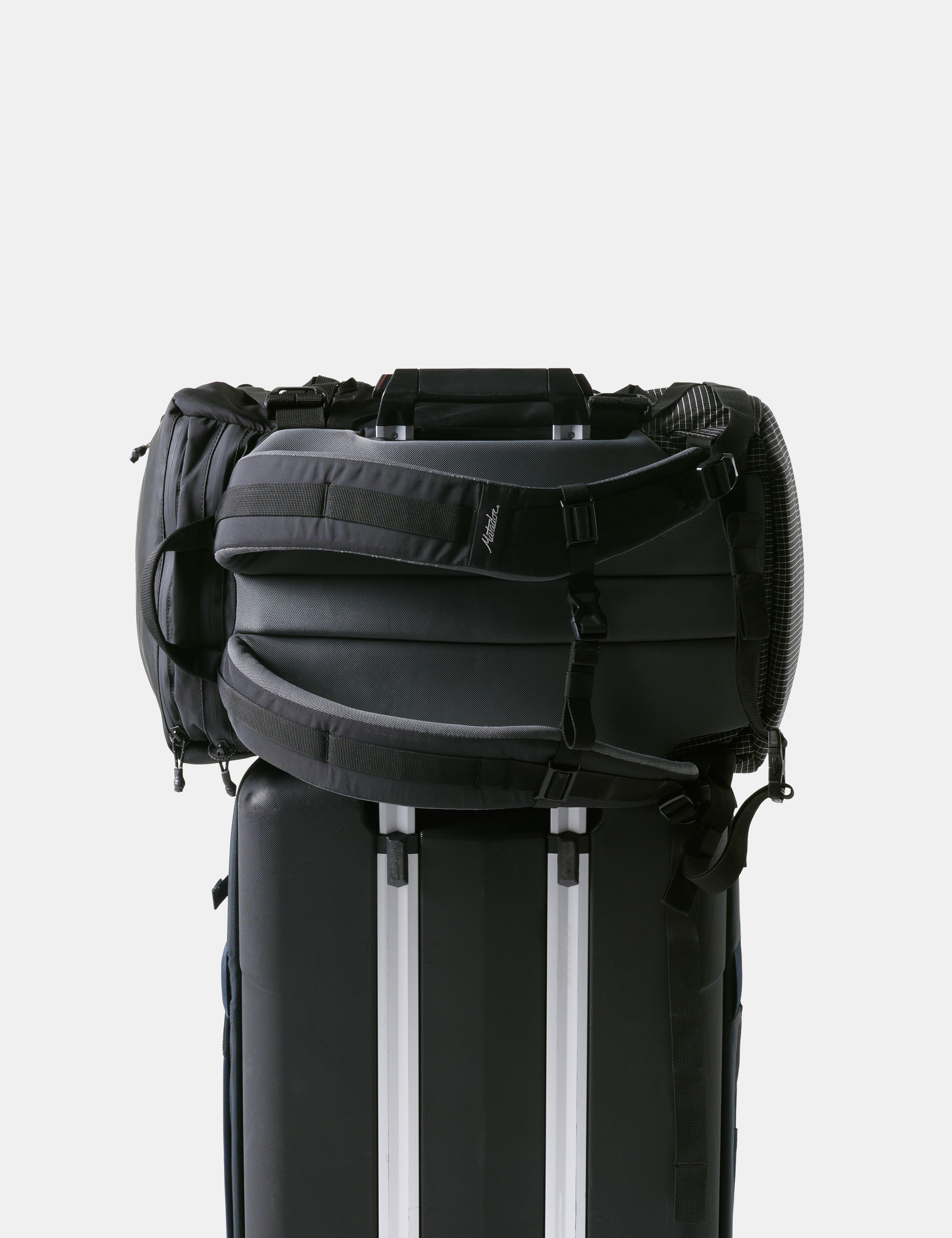 Black backpack with a white stripe on a light gray background