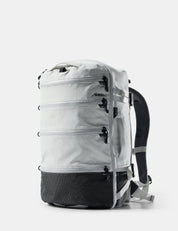 White backpack with black accents on a light gray background