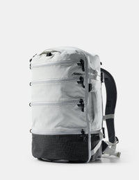 White backpack with black accents on a light gray background