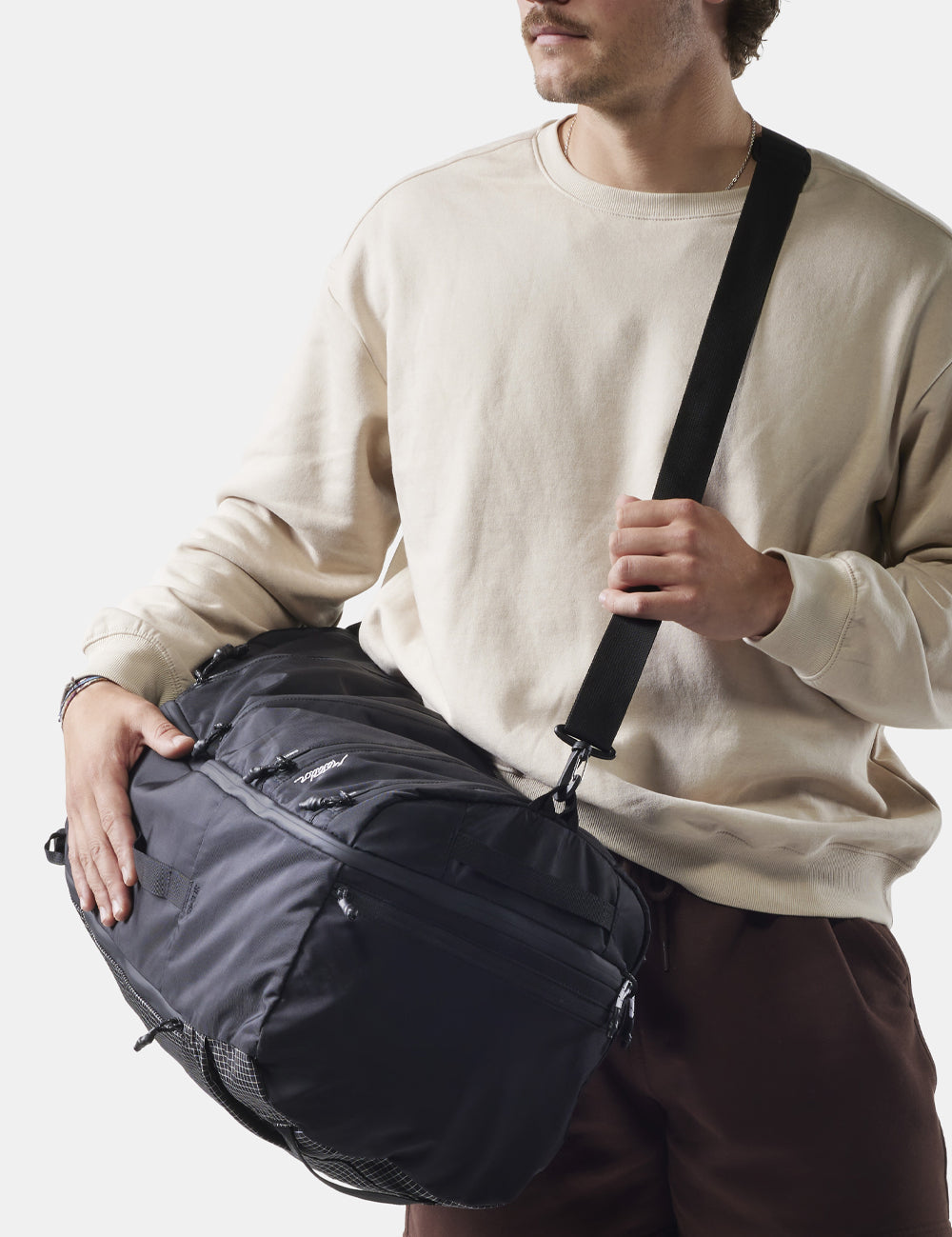 man on white background wearing seg45 cross body