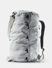 Light gray backpack with multiple zippers on a white background