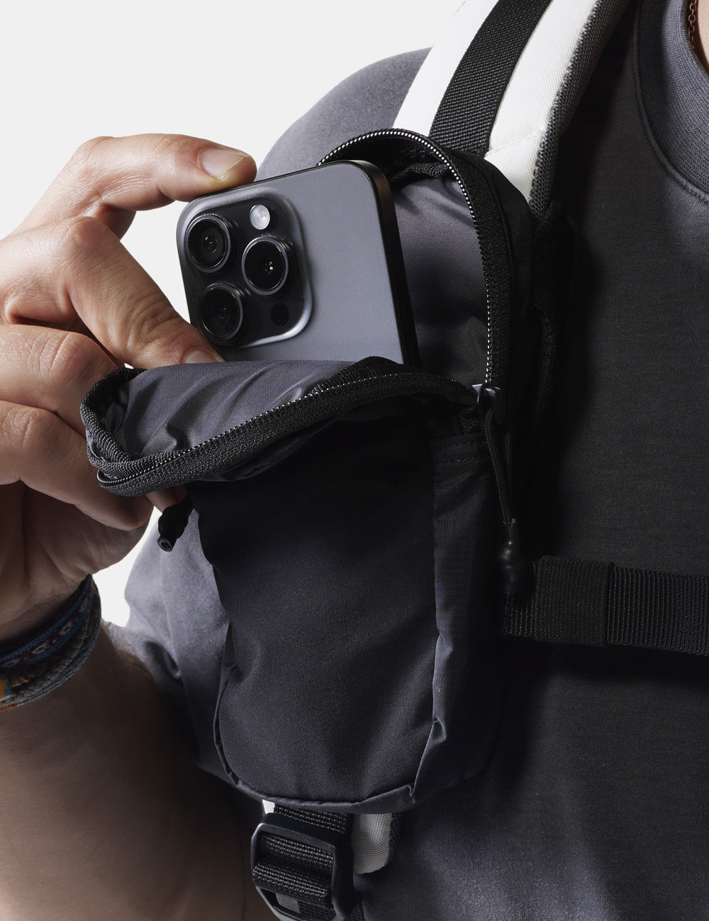 placing phone in black speed stash