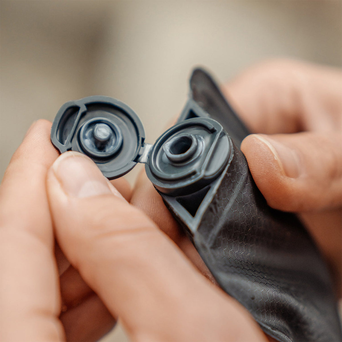 Close up view of hands with open lid