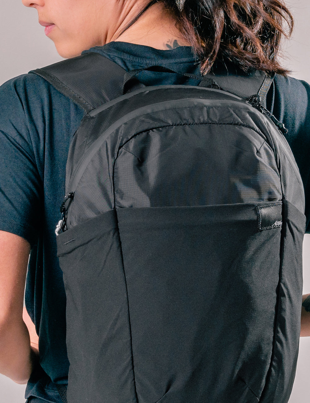 woman wearing black backpack