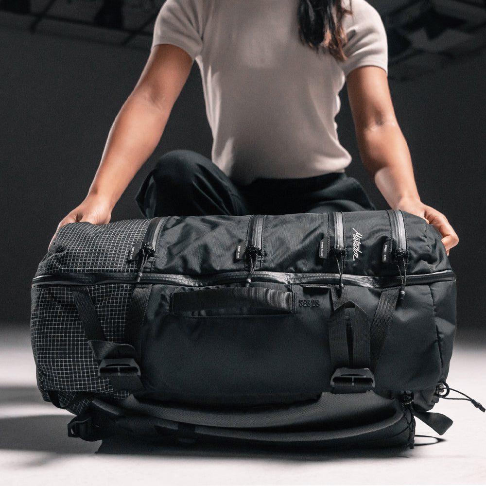 Woman placing SEG28 on the ground in a photo studio