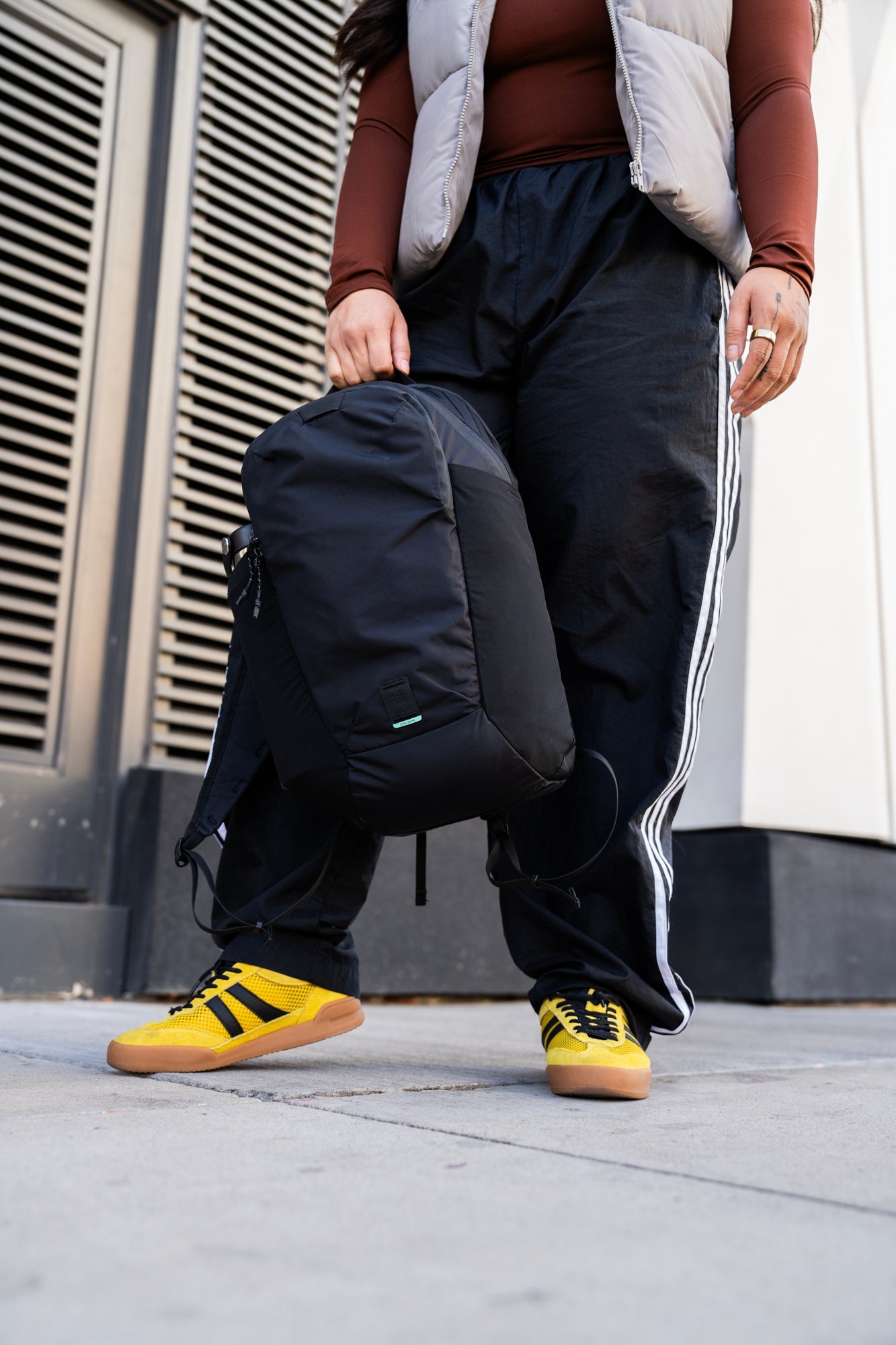 person holding a bag by the grab handle